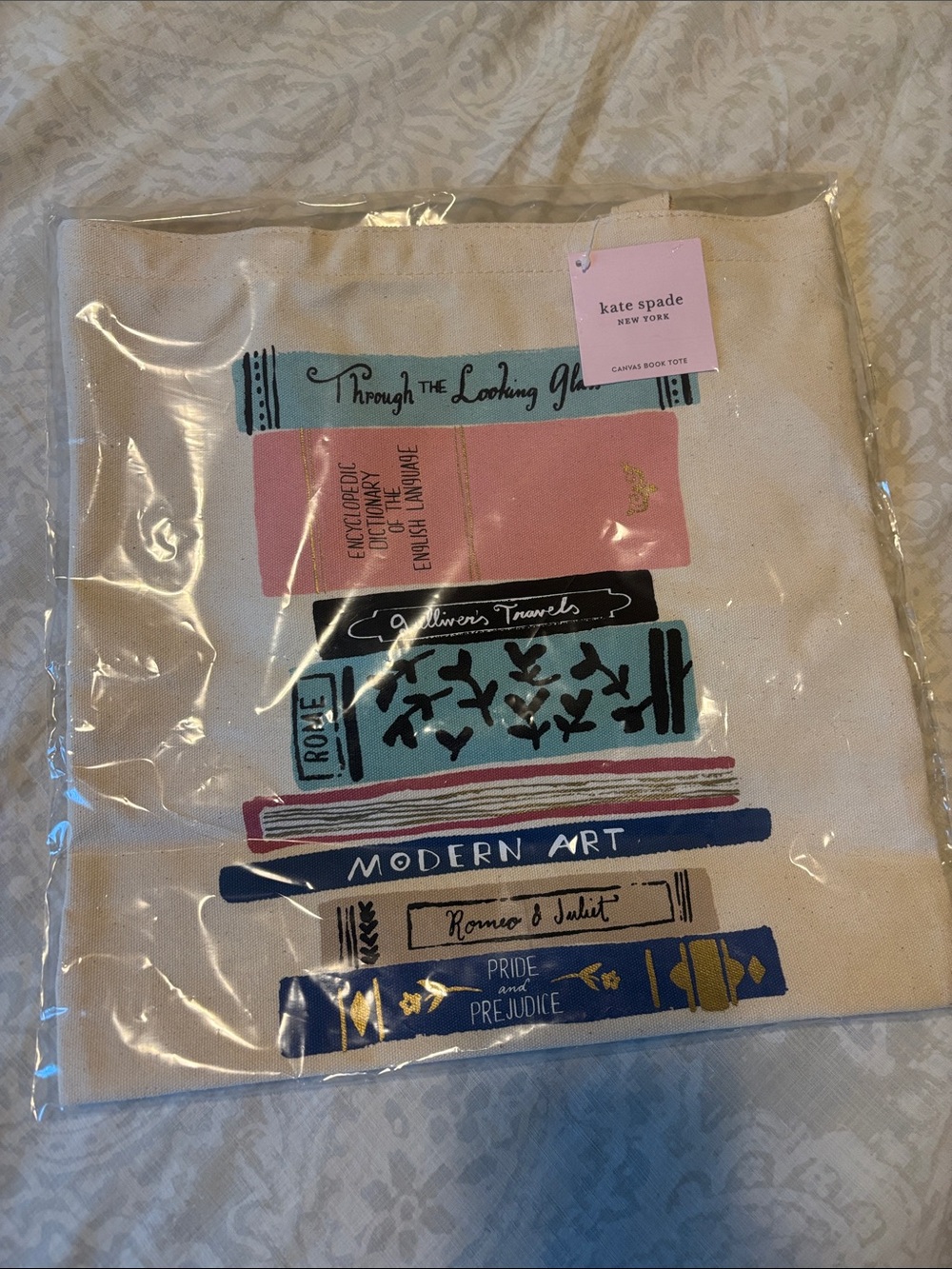 kate spade Canvas Tote with Pink, Blue & Gold Stacked Book Print